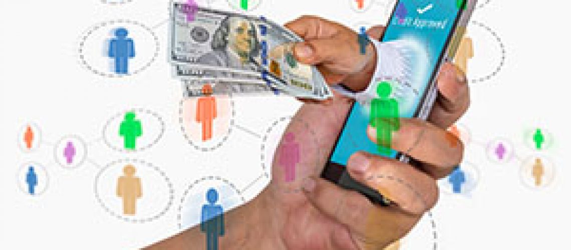 Mobile commerce and payment concept. Hand holding smart phone with credit approved message and hand sending money out of screen with social network icons.